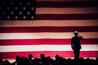 soldier saluting an American flag