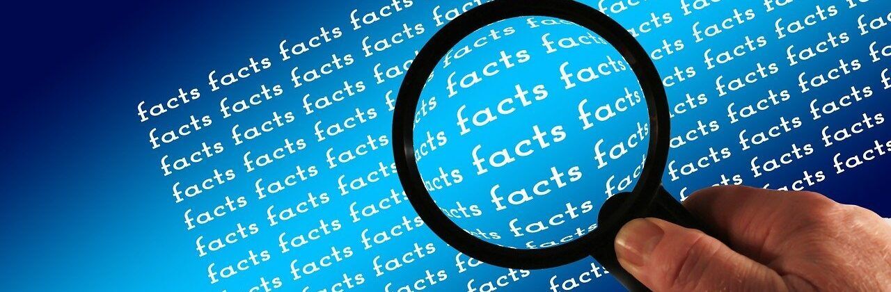spyglass around the word "Facts."